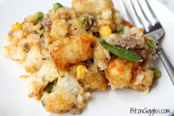 A serving of Tater Tot Casserole with fork.