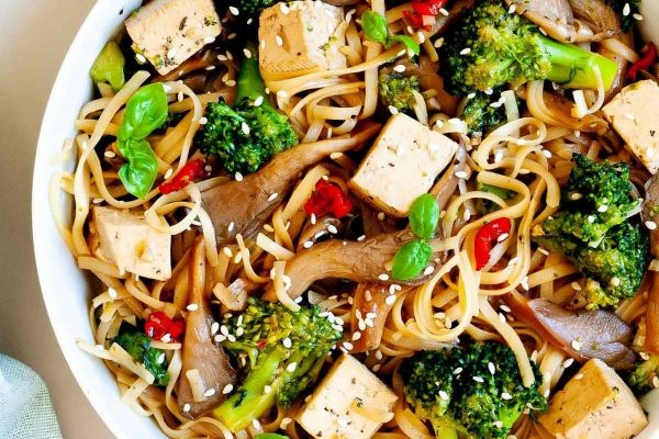 Thai Oyster Mushroom Noodle Stir Fry. with tofu and lots of vegetables.