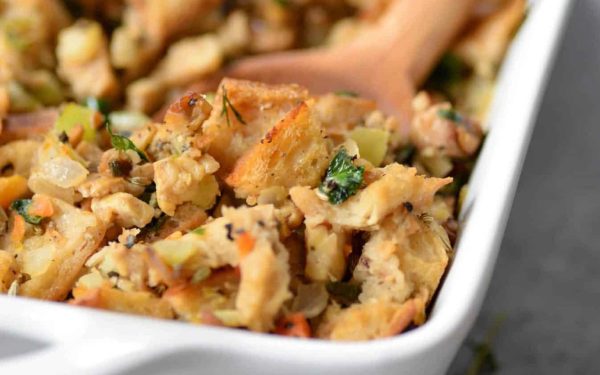 Stuffing in a white casserole dish.