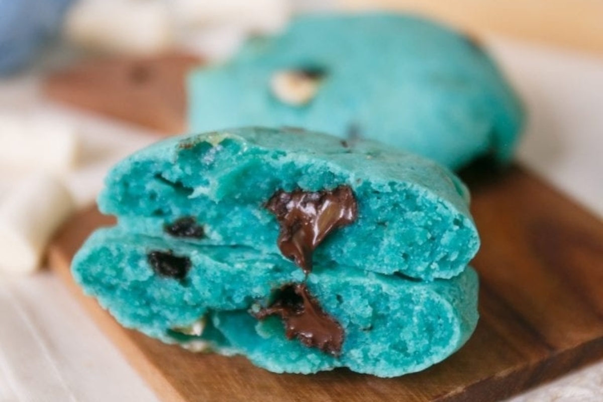 Bright blue colored cookies with chocolate chips.