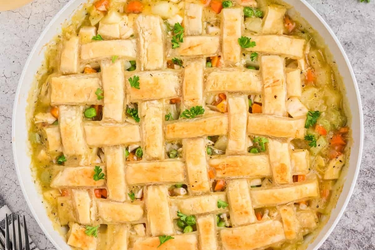 Turkey Pot Pie with Puff Pastry and a lattice in a round dish. 