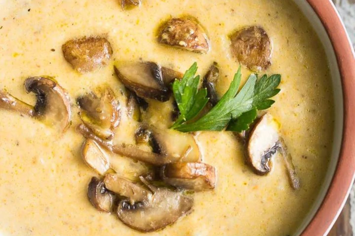 Ukranian Mushroom Soup with mushroom in a white bowl
