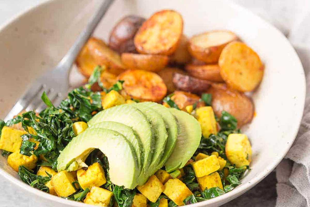 Colorful potato and vegetable has with spices.