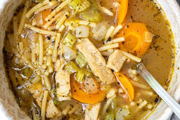 A bowl filled with Vegan Chicken Noodle Soup. 