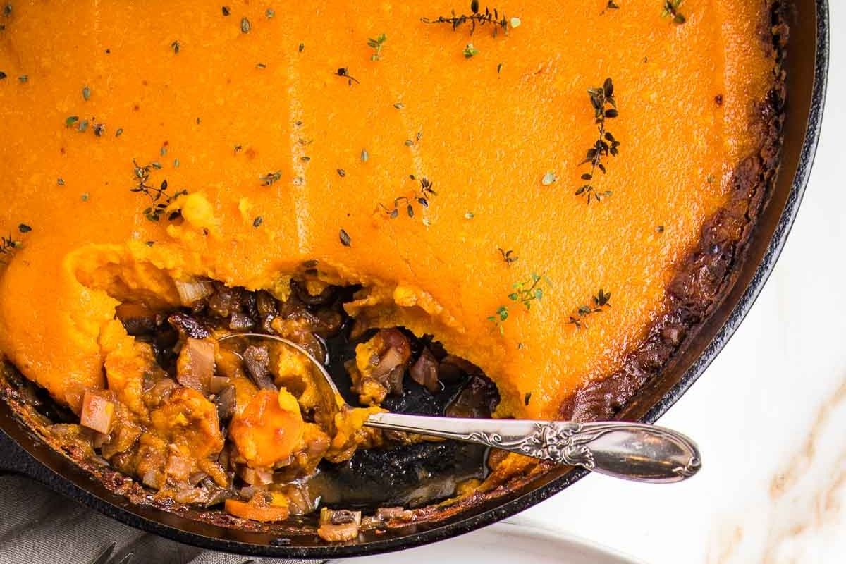 Sweet potato casserole in a skillet, perfect for sweet potato recipes.