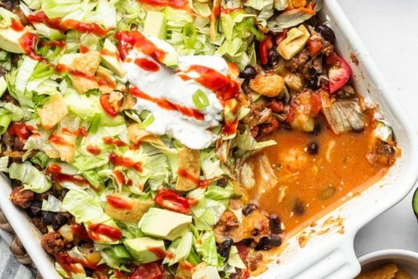 Mexican casserole with sour cream and guacamole.