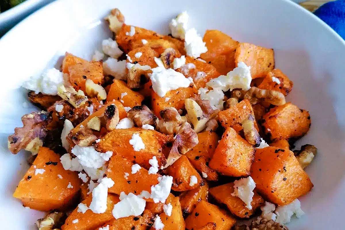 Butternut squash in a bowl with feta.