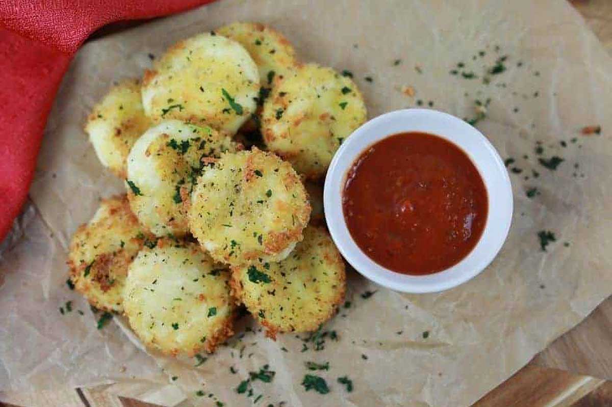 Air fryer Babybel cheese with a dipping sauce.