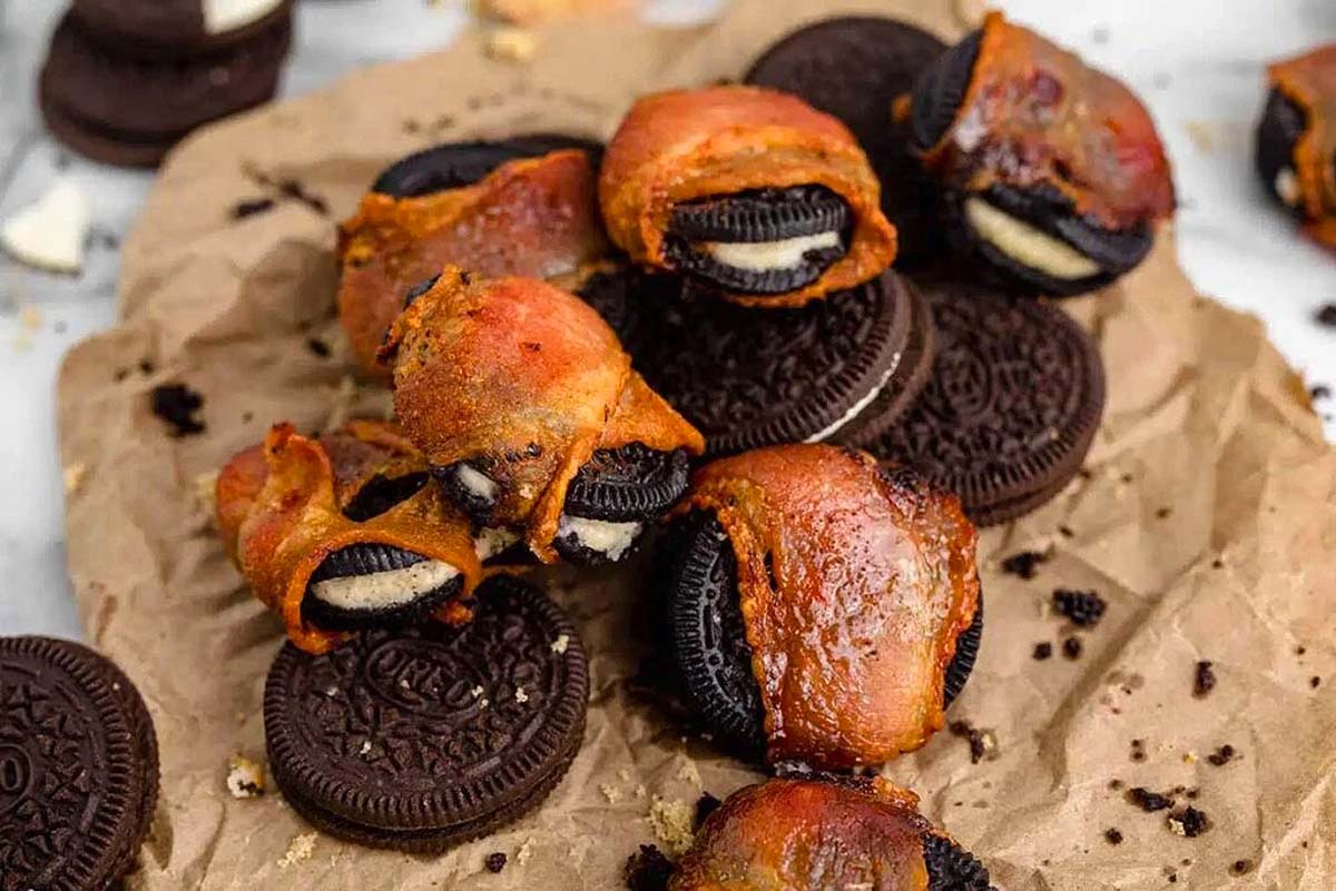 A pile of bacon wrapped oreo cookies.