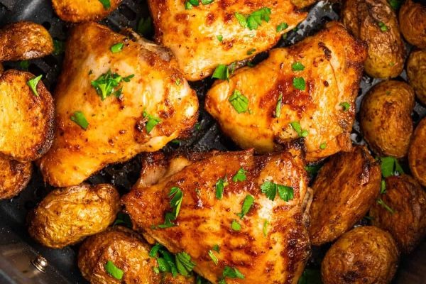 Air fryer chicken thighs with spices.