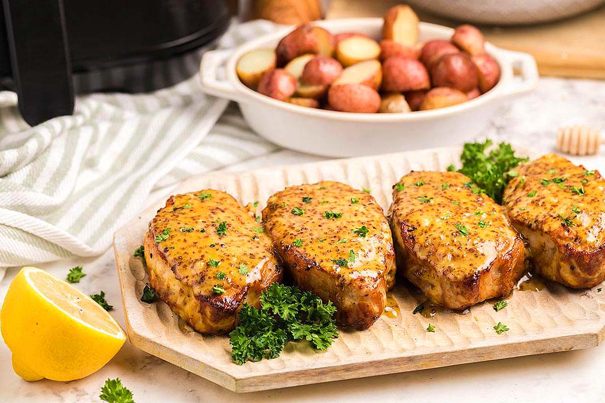 Honey mustard pork chops on a platter.
