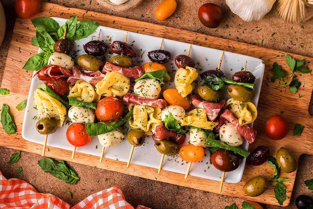 Antipasto Skewers on a white plate.