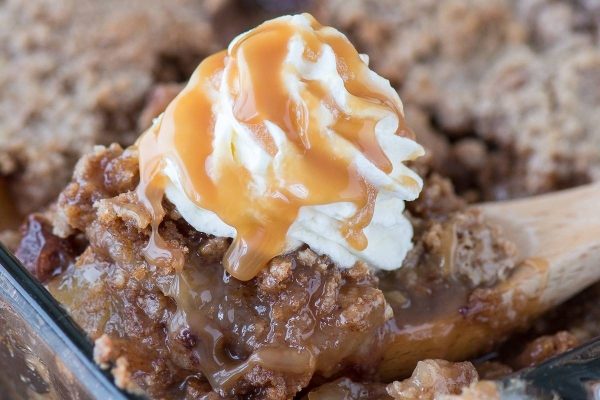 Slice of apple dump cake with ice cream.