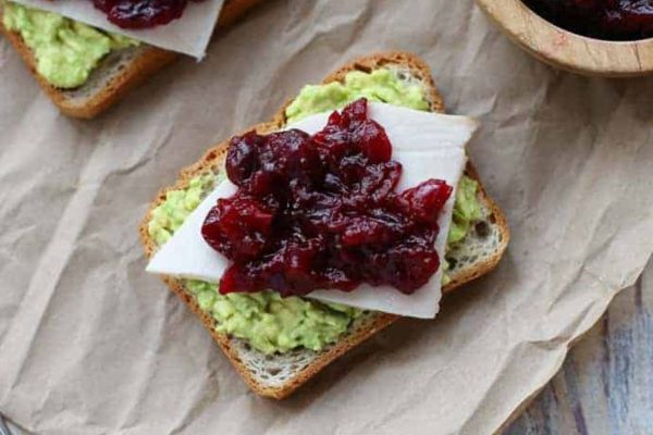 avocado toast with turkey and cranberry sauce.