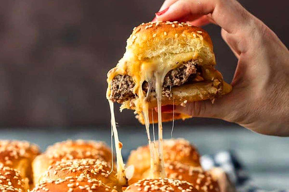 Sliders with beef patties and melted cheese.