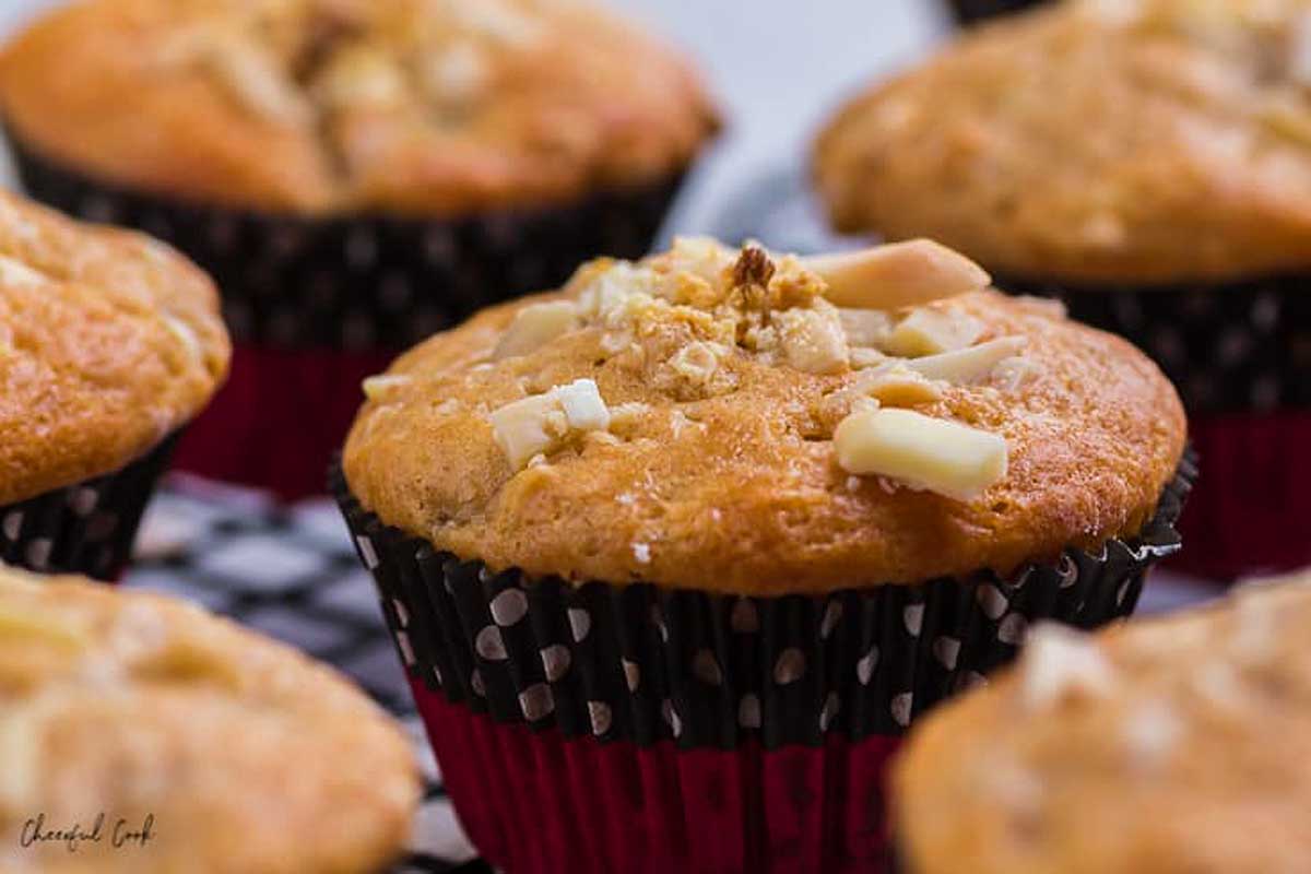 Banana muffins with slivered almonds on top.