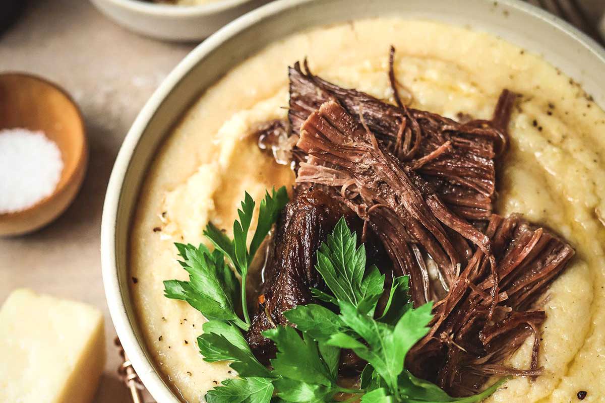 Braised Beef with Red Wine on top of potatoes.