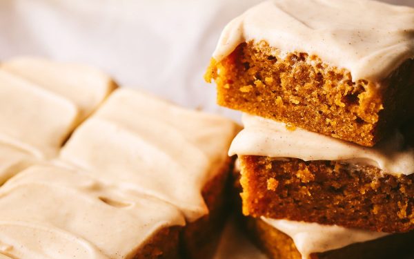 Slices of Brown Butter Pumpkin Blondies with frosting