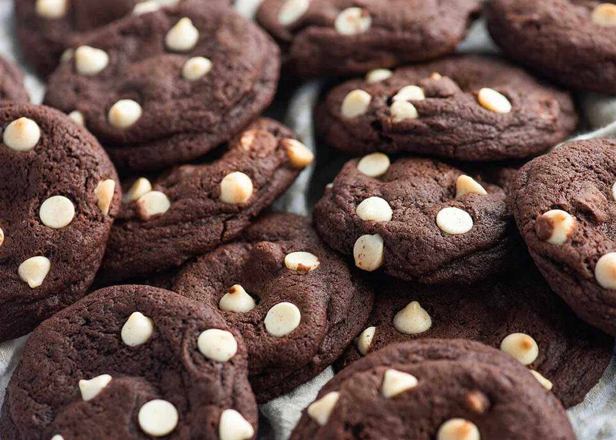 Caramel stuffed chocolate chip cookies on a tray. It's one of the best chocolate chip cookie recipes.