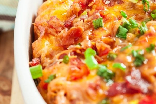 Cheesy bacon pull aparts in a white serving dish.