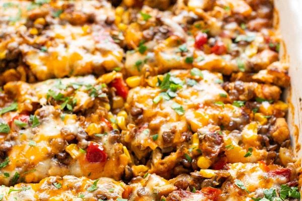 Chicken and lentil casserole covered in cheese.