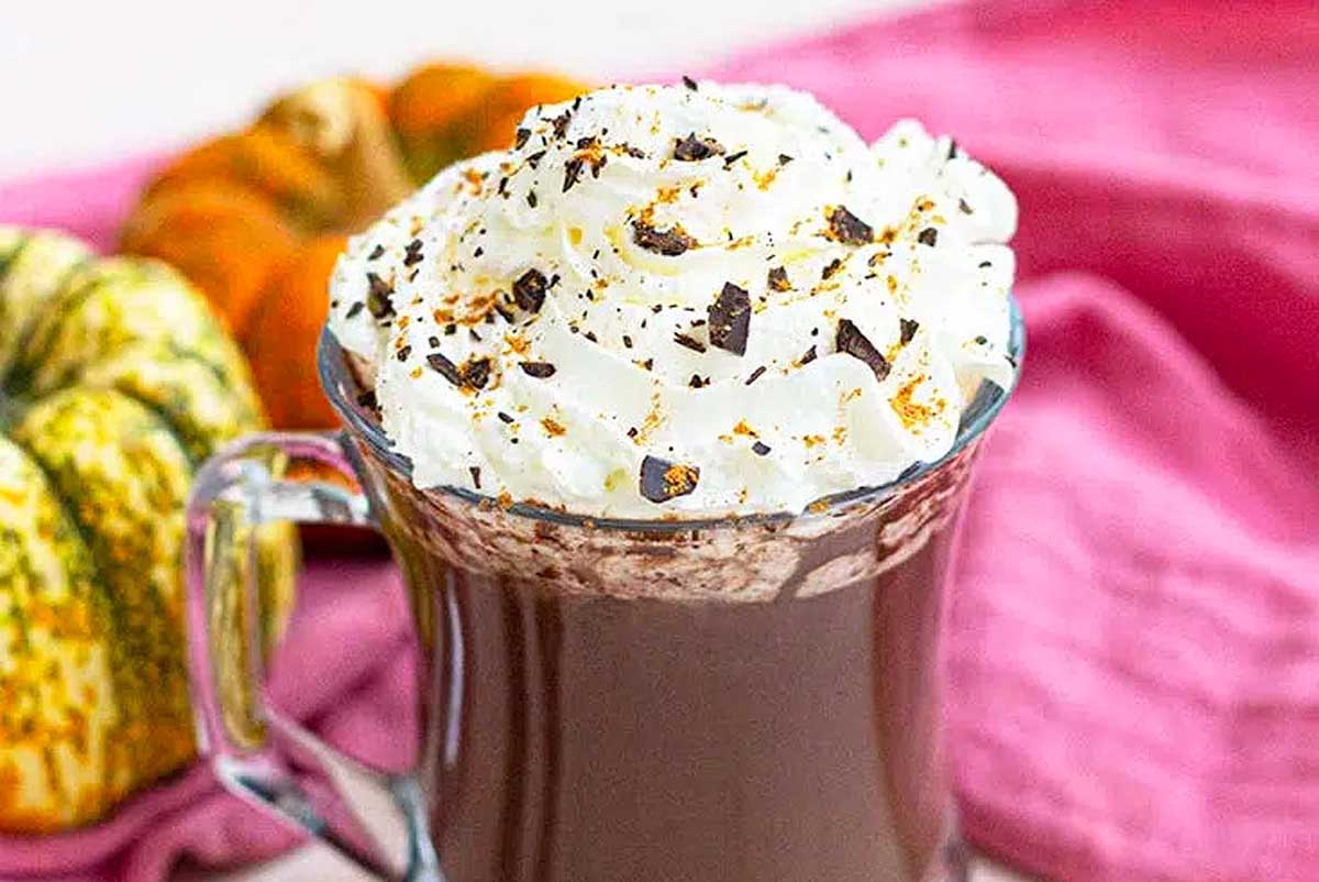 Pumpkin spice hot chocolate with whipped cream.