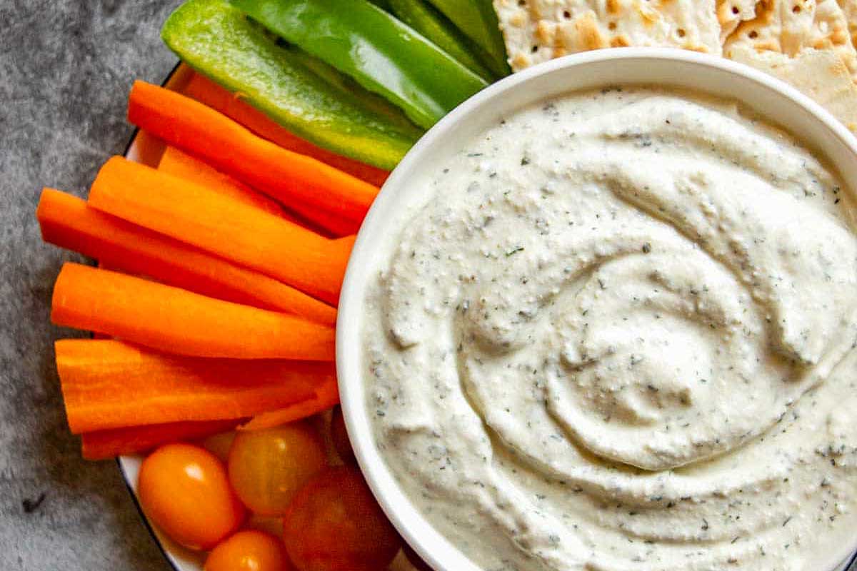 Herbed Cottage Cheese dip with vegetables and chips.