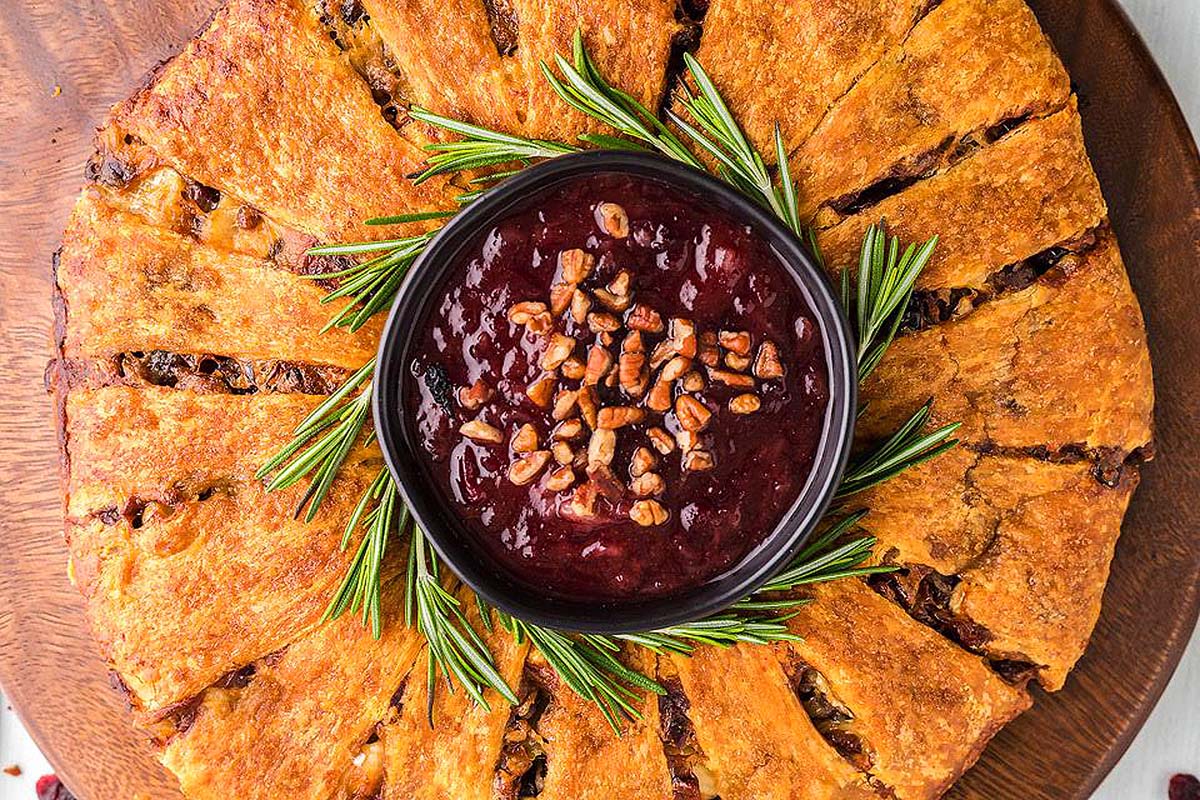 An appetizer with cranberry and brie.