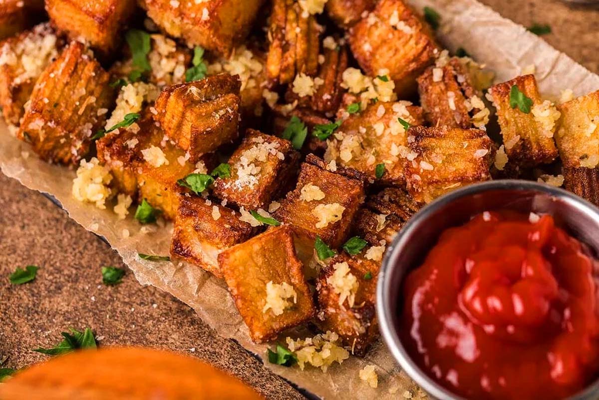 Crispy stacked potatoes on a plate.