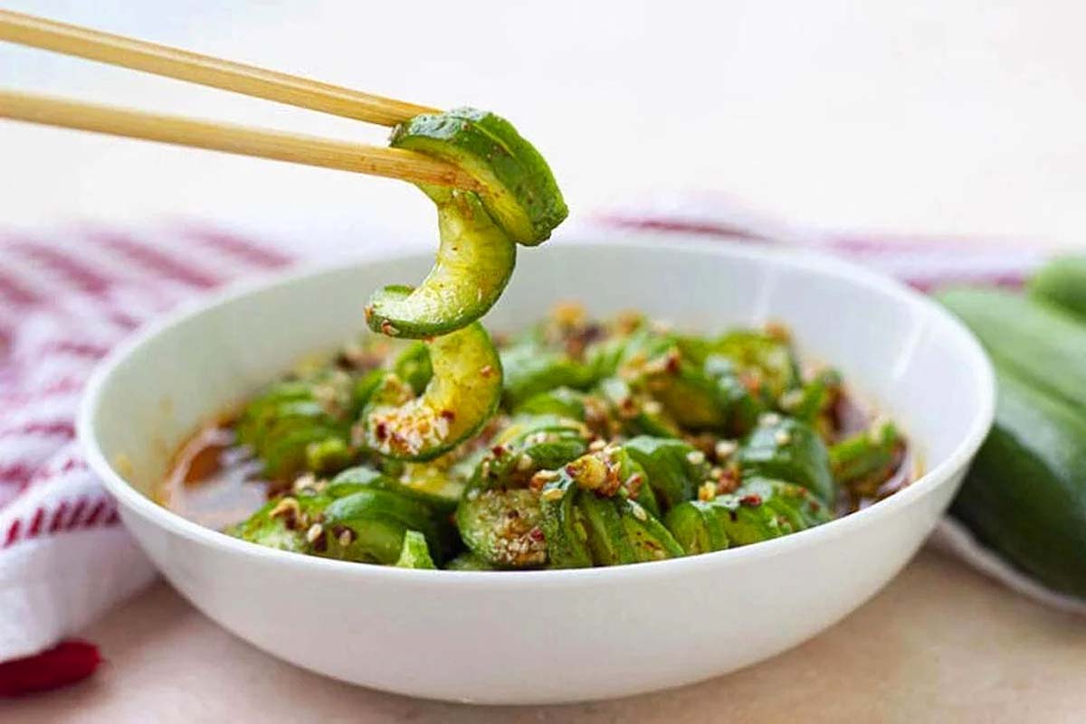 A bowl with cucumber salad. 