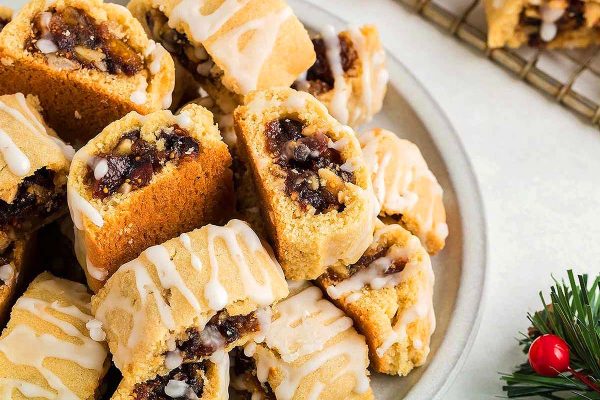 Fig filled cookies with frosting drizzled on top.