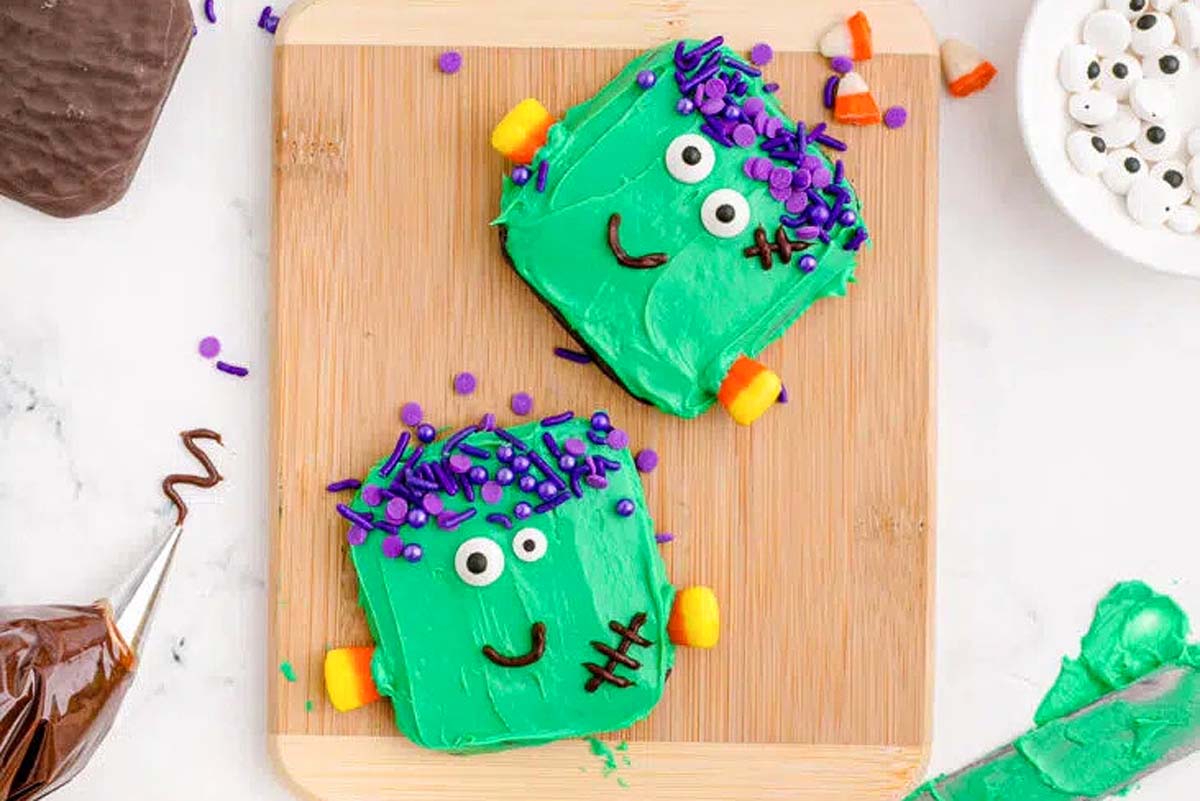 Frankenstein Halloween Cookies on a cutting board.
