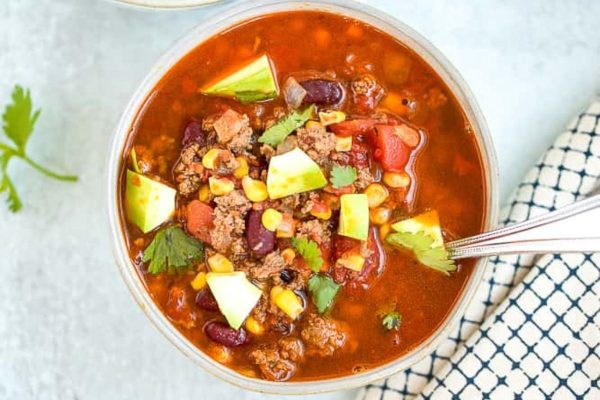 Instant pot taco soup with avocado topping.