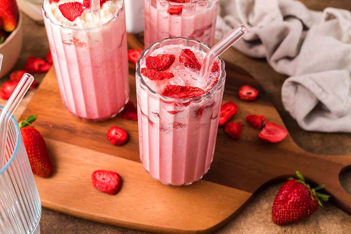 A pink drink from Starbucks in glasses.