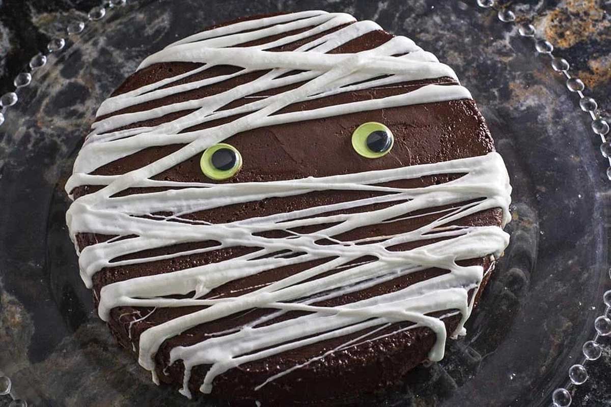 Flourless chocolate cake with mummy icing on top. 