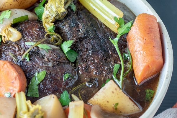 Pot roast with carrots, celery, and potatoes. 