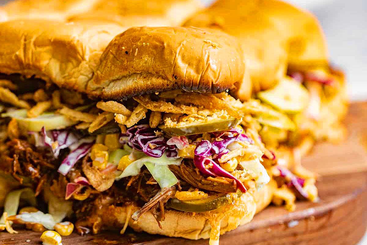 Colorful pulled pork sliders with slaw.