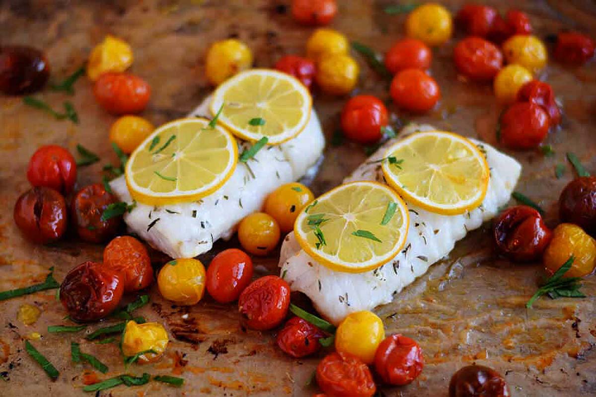 Roasted cod with lemon slices over the top.