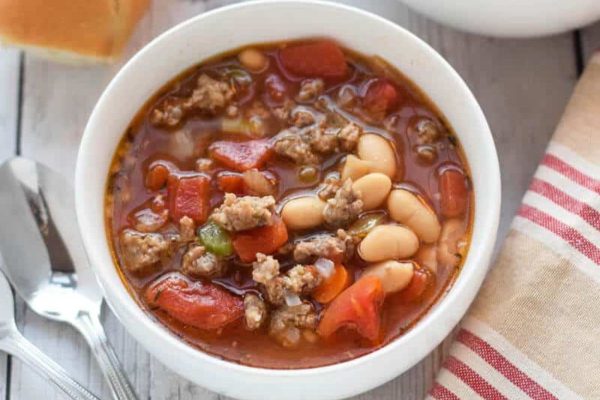 Bowl of sausage and bean soup. 