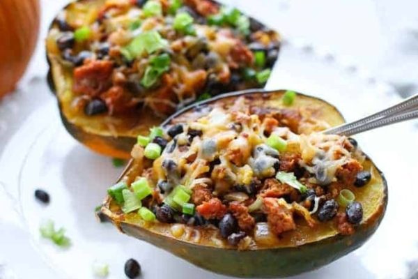 Two sausage and bean stuffed squash.