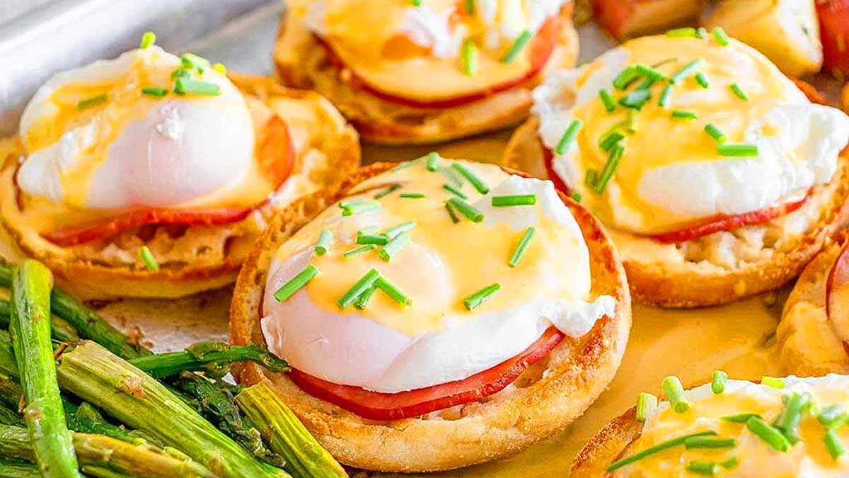 Sheet Pan Eggs Benedict with asparagus on the side.