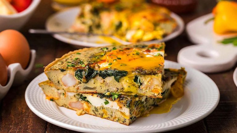 A delicious quiche with spinach and eggs, perfect for a breakfast-for-dinner meal.