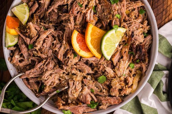 Overhead view of a large bowl of smoked pulled pork.