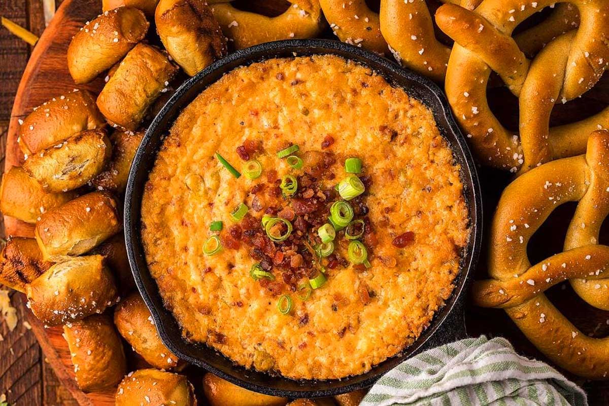 Smoked guda bacon cheddar cheese dip with pretzels.
