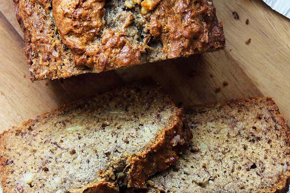 Sliced banana bread on a cutting board.
