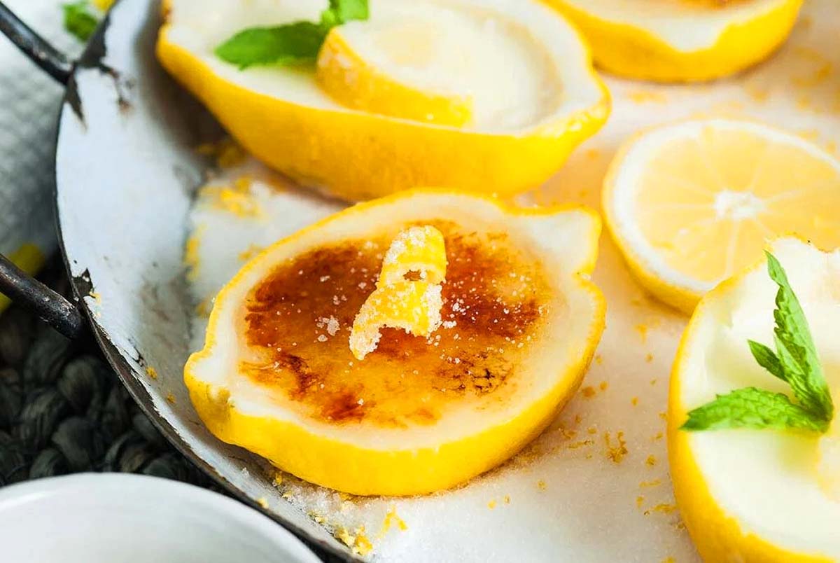 A lemon dessert served in a lemon shell. 