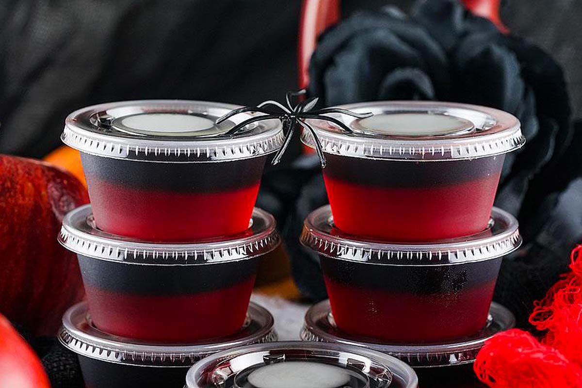 Halloween jellos shots that are black and red.