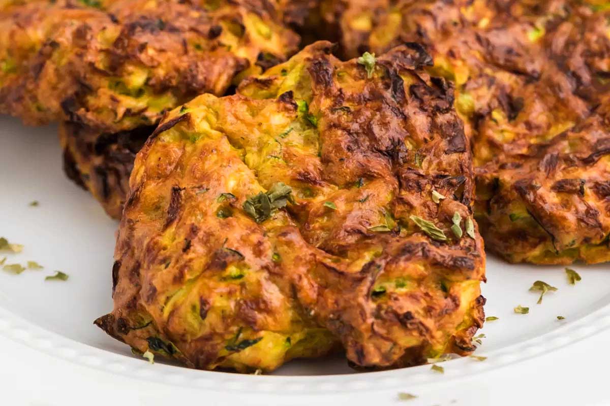 Zucchini fritters on a plate.