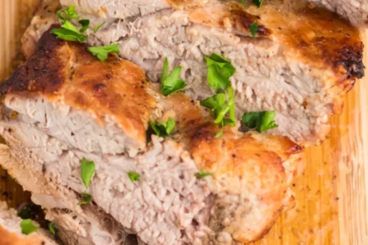 Pork tenderloin on a board.