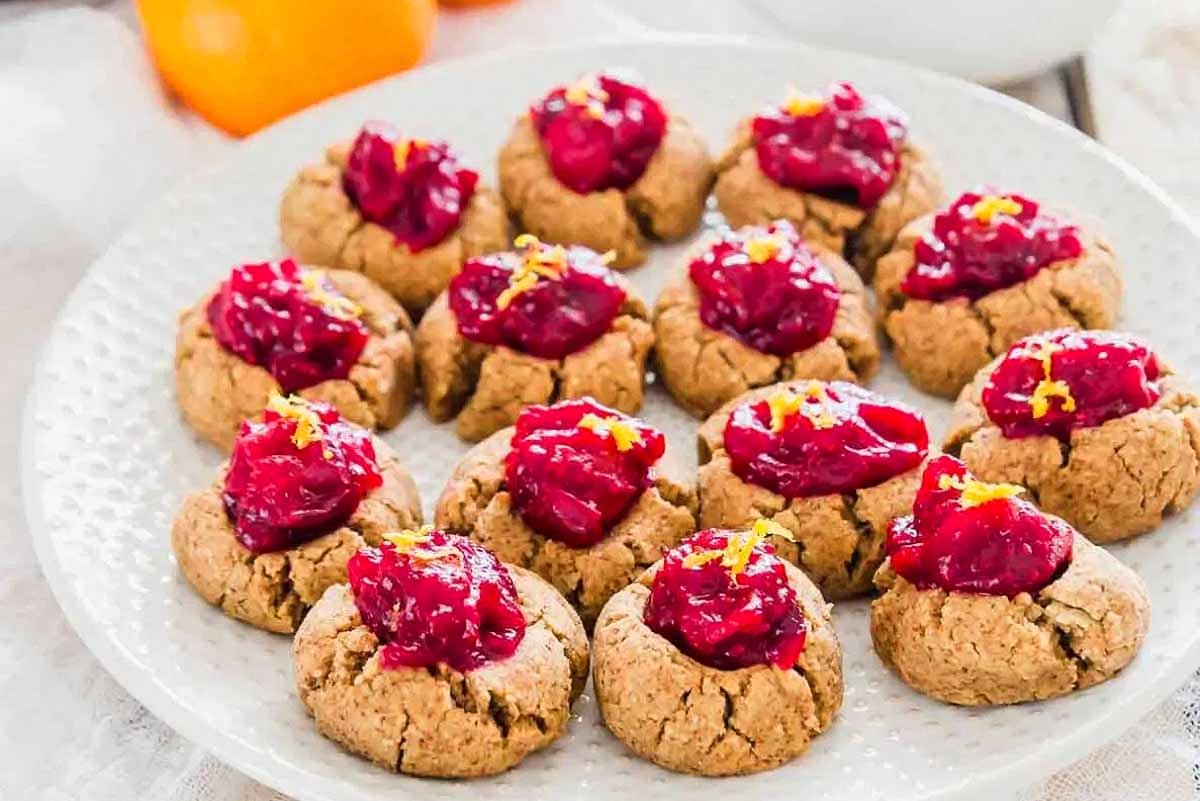 Almond Pulp Cookies sitting on a white plate.